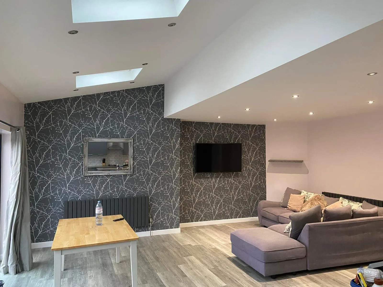 Wallpapering lounge dark feature wall